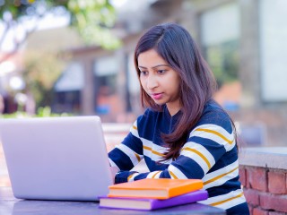 Woman looking at laptop