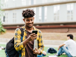 University student looking at phone