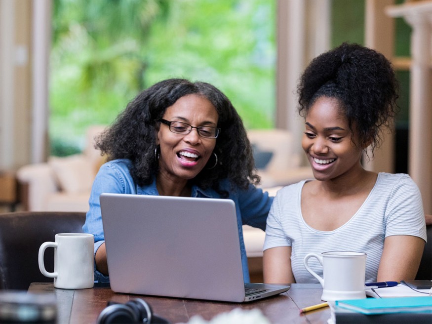 Parent and student looking at computer